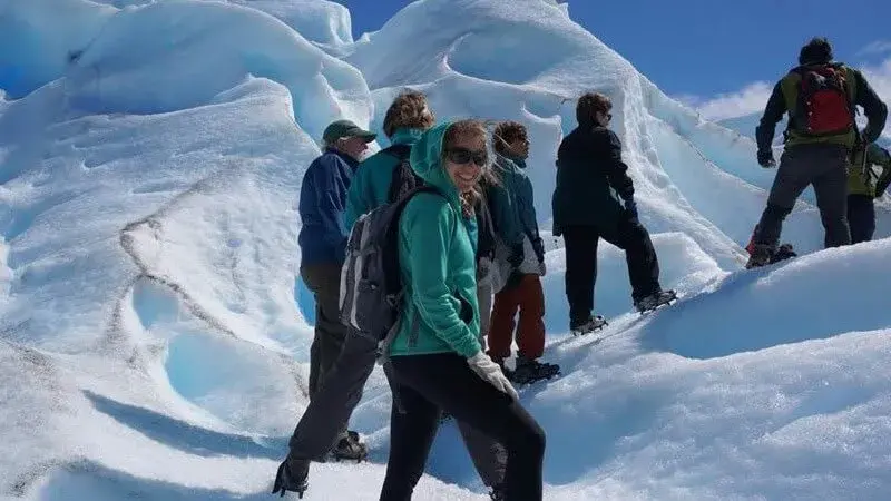 Adventure tourists walking on the glacier