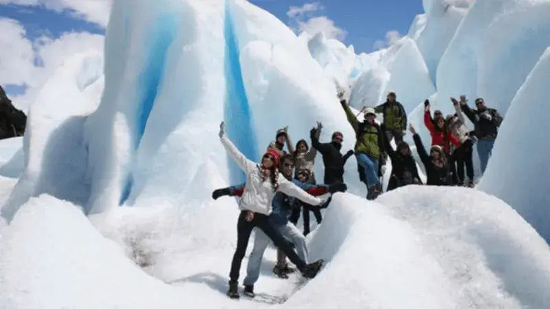 Adventure tourists walking on the glacier
